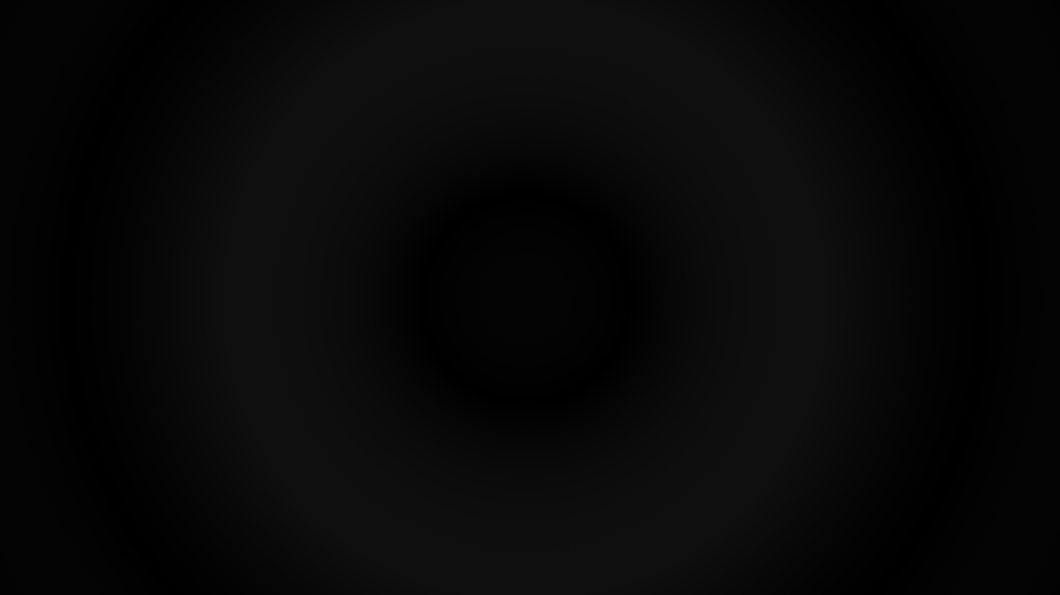 A dark, gray ring softly blurred against a black background.