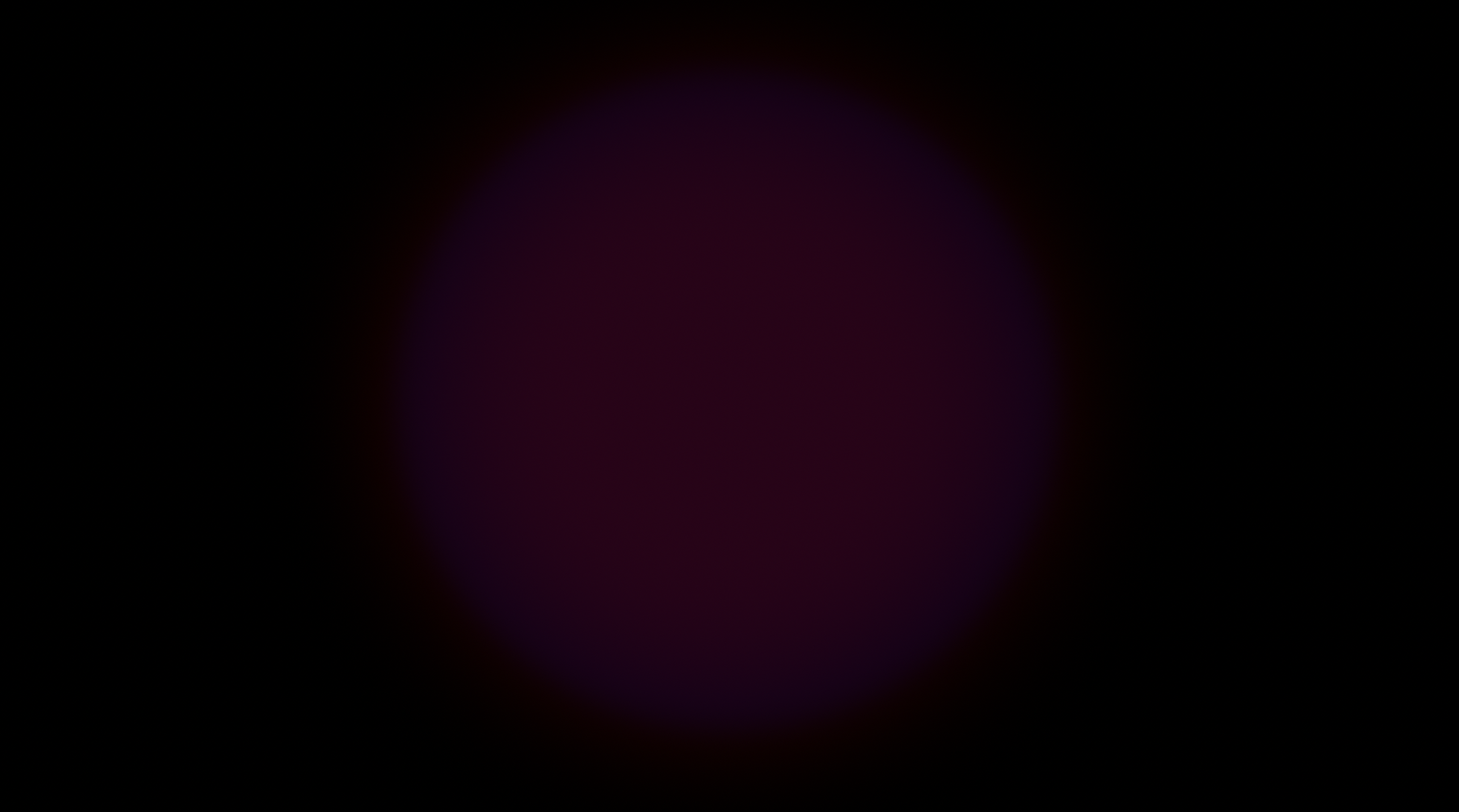 Two blurred circles, red and blue, against a black field.