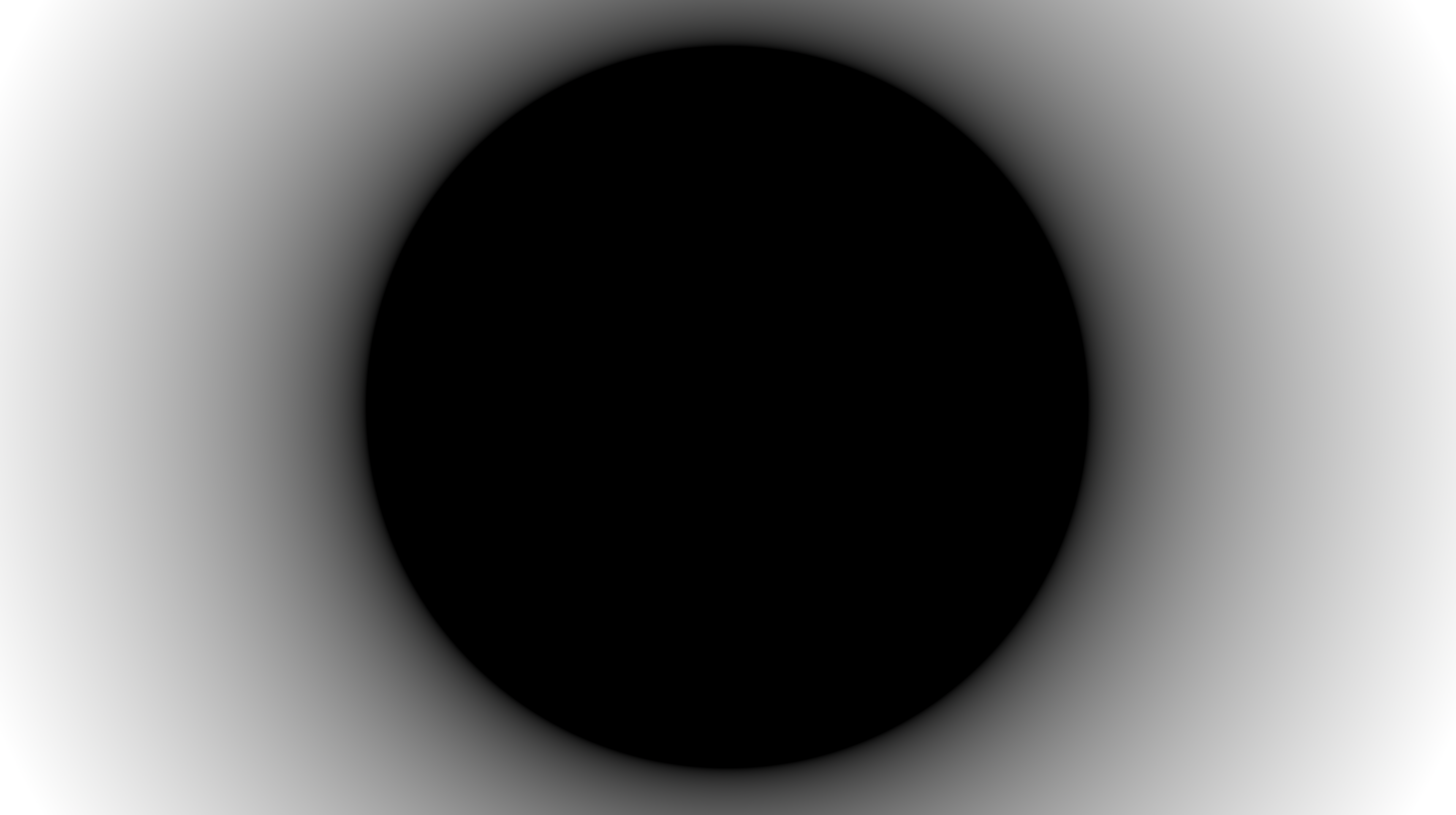 A blurred, black circle against a white background.